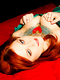 Misti Dawn strips on a red mattress and shows her pink